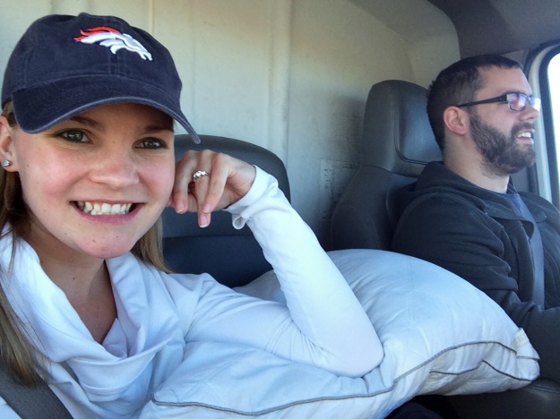 Unrelated picture of BF and I in our Uhaul. The cat is in his cage under that pillow. He hated every minute. Also, Broncos.